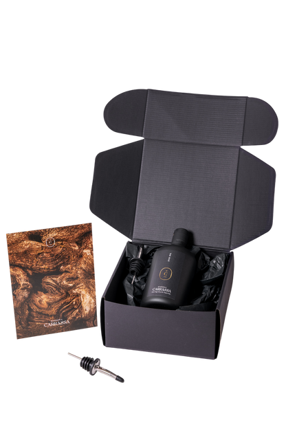 Open Masseria Carrassa gift box showing olive oil bottle and droppe