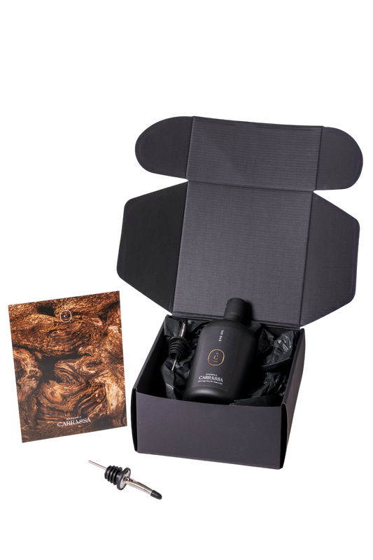 Open Masseria Carrassa gift box showing olive oil bottle and droppe