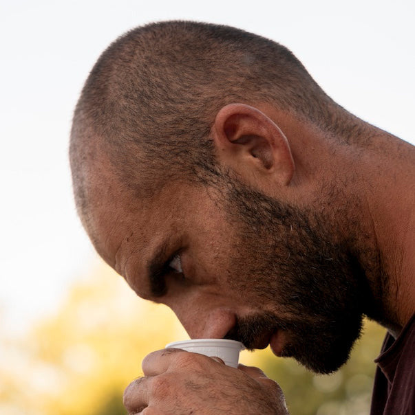 Piero smelling olive oil imidiately after press