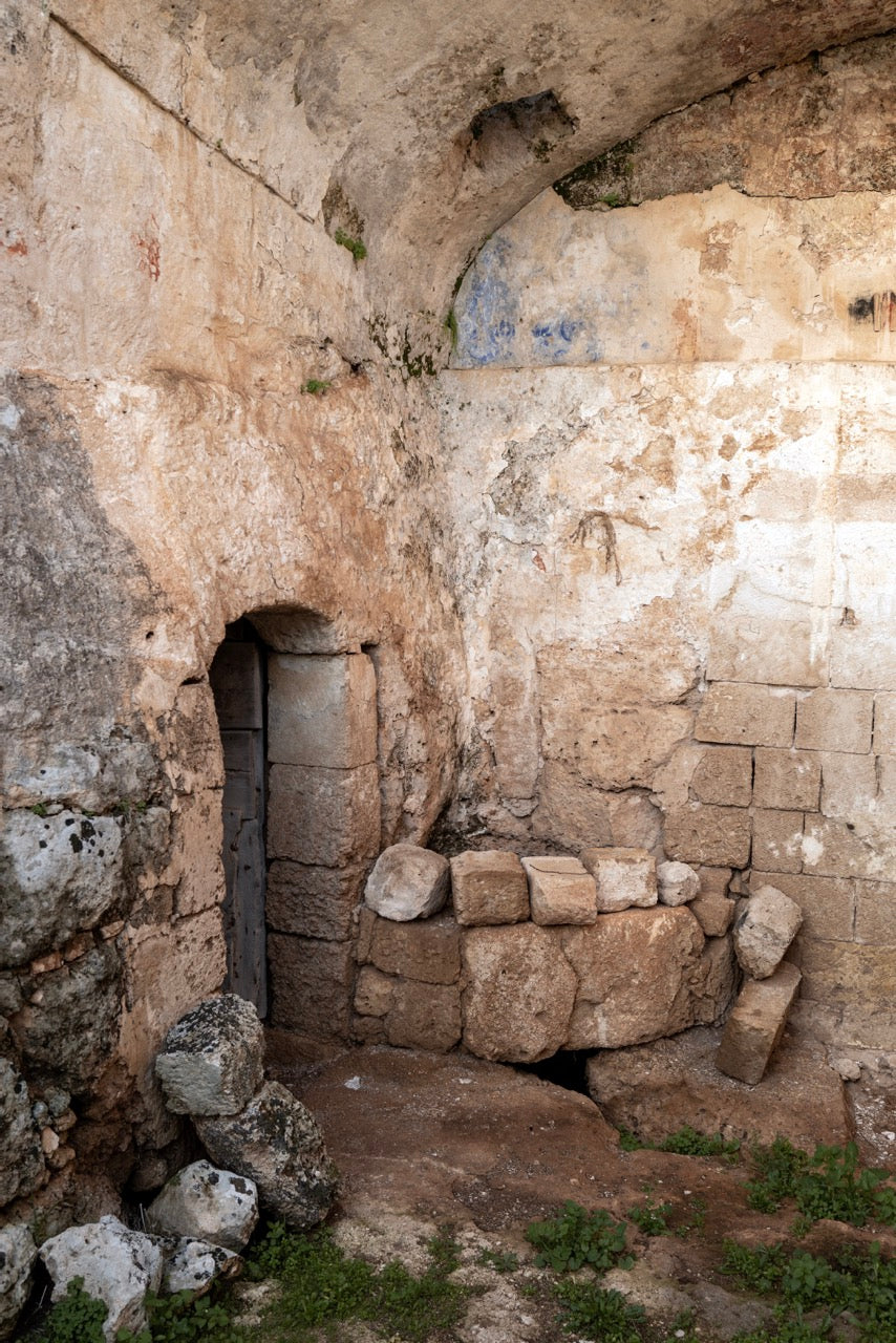 Ancient stone doorway carved into cave grotto wall